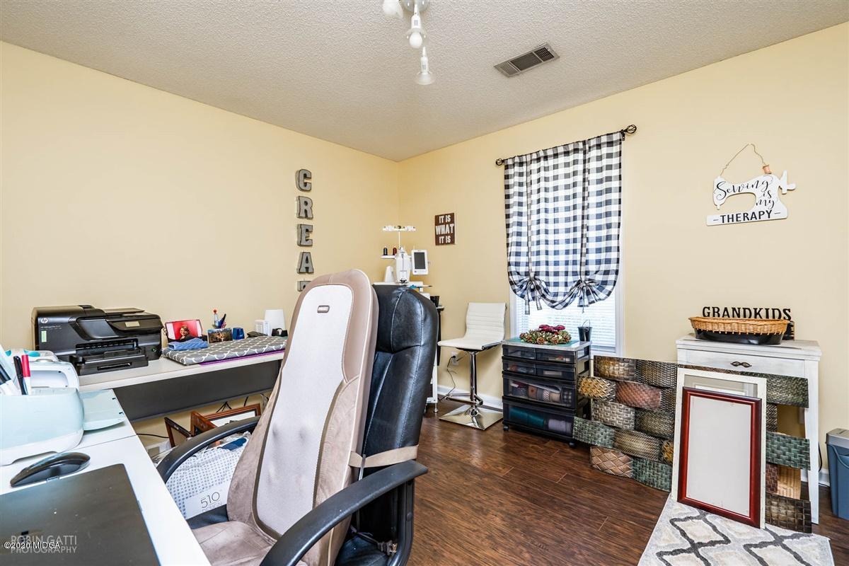 6180 Skipperton Road Macon, GA 31216 - Photo 22 of 37 a view of a workspace with furniture and a window