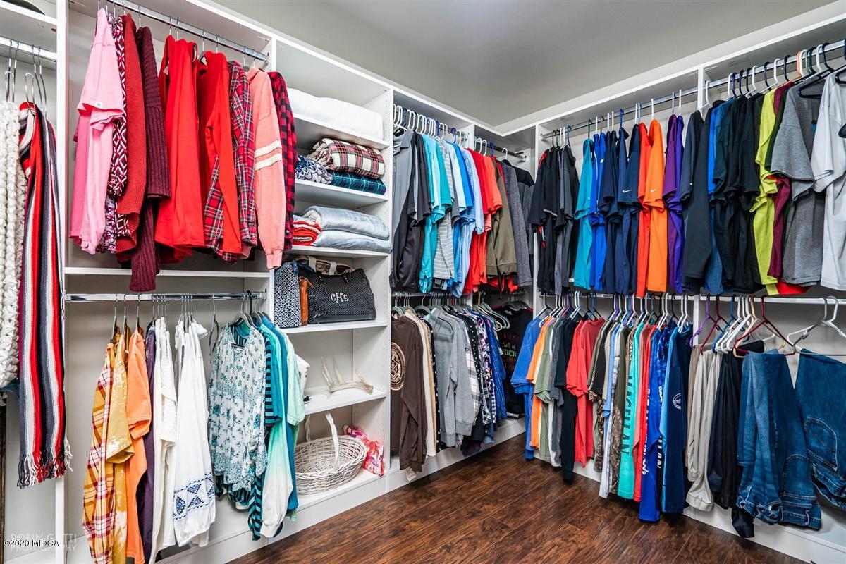 6180 Skipperton Road Macon, GA 31216 - Photo 24 of 37 a view of walk in closet with clothes