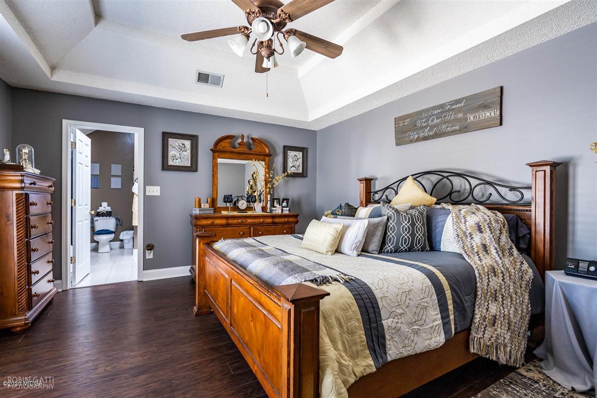6180 Skipperton Road Macon, GA 31216 - Photo 25 of 37 a bedroom with bed and wooden floor