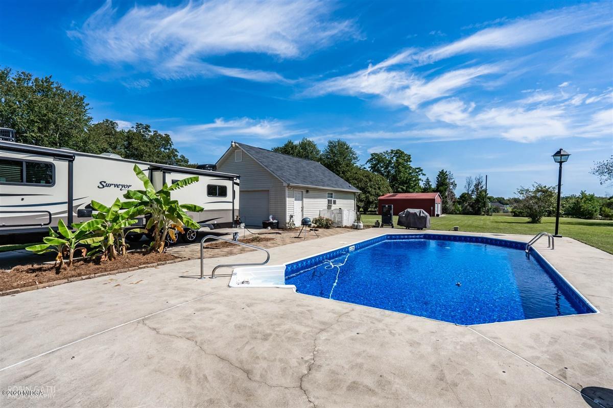 6180 Skipperton Road Macon, GA 31216 - Photo 31 of 37 a view of a house with swimming pool