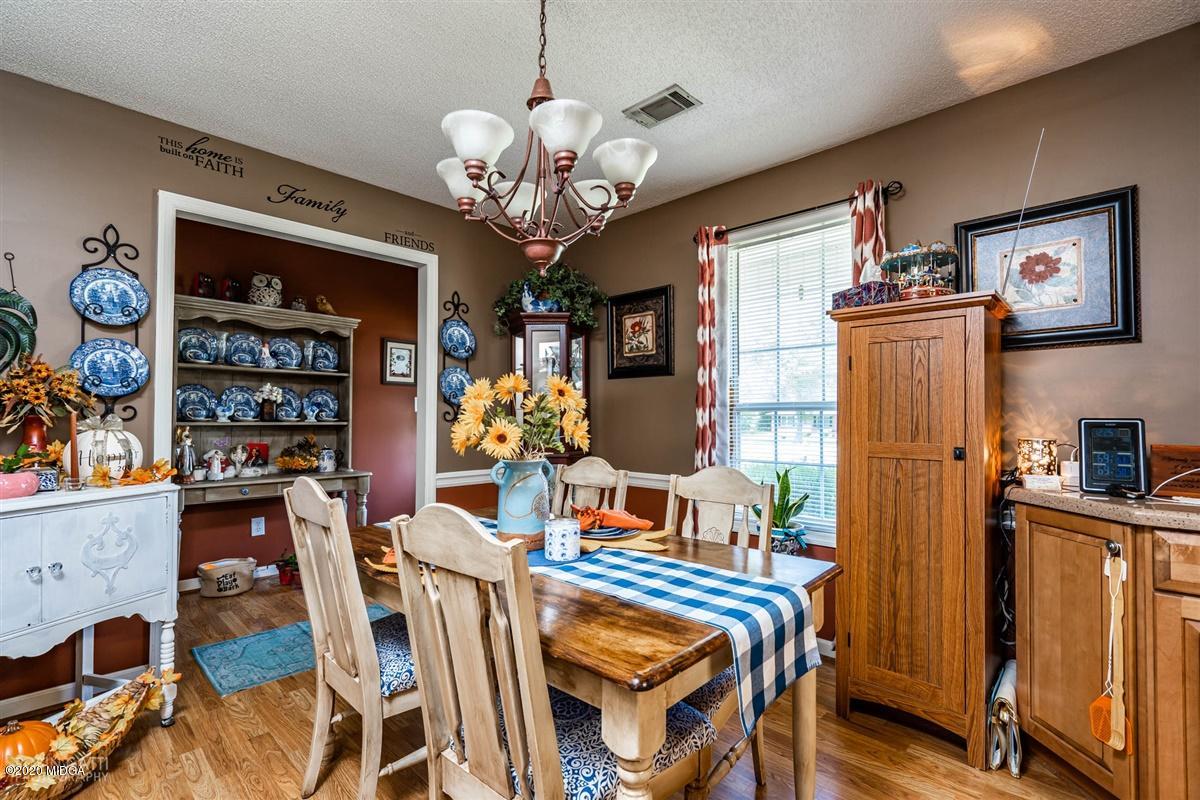 6180 Skipperton Road Macon, GA 31216 - Photo 7 of 37 a view of a dining room with furniture and chandelier