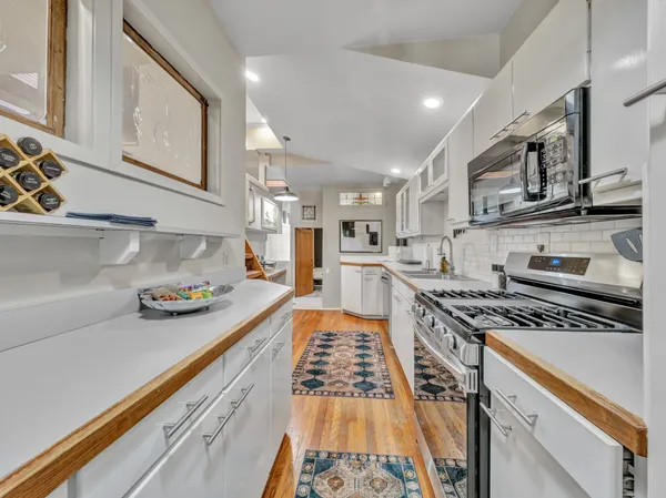 a kitchen with wooden cabinets and sink