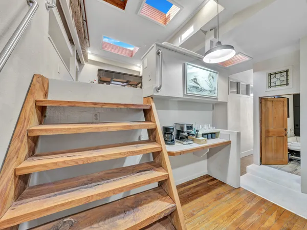 a bedroom with a bed and a bookshelf