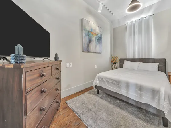 view of a room with wooden floor and a wooden door