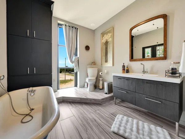 a bed room with a bed and a flat screen tv