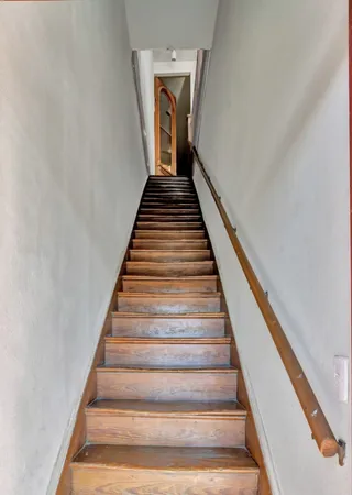 a view of livingroom with furniture and workspace