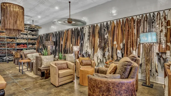 a view of a patio with table and chairs potted plants