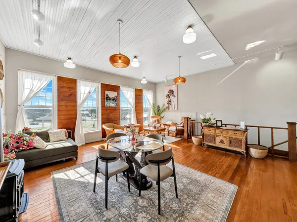 an open kitchen with a table and chairs in it