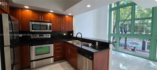 a kitchen with a stove and a microwave