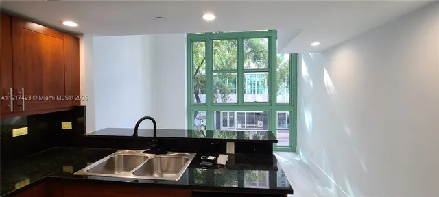 a kitchen with a sink and a window
