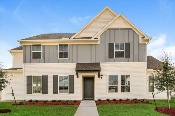 a view of a hallway with wooden floor and a cabinet