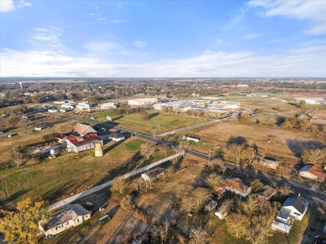 an aerial view of residential building and ocean