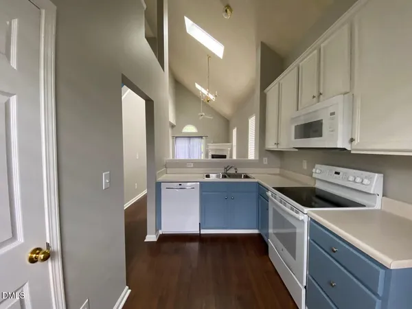 a kitchen with a sink cabinets and stainless steel appliances