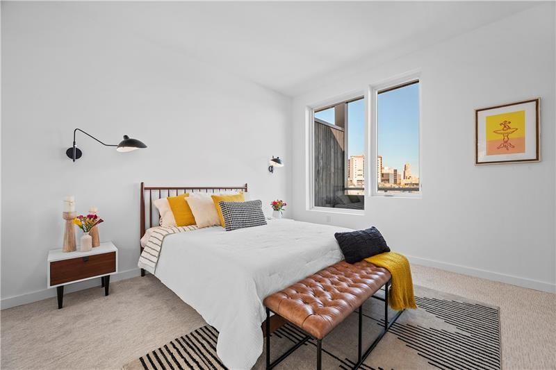 112 Burrows Street Pittsburgh, PA 15213 - Photo 12 of 13 a bedroom with a bed and wooden floor