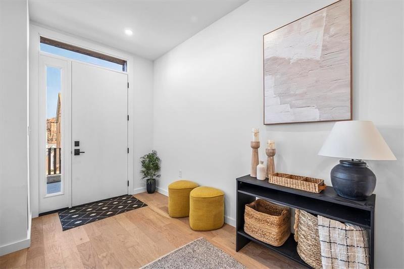 112 Burrows Street Pittsburgh, PA 15213 - Photo 3 of 13 a bedroom with furniture and a lamp