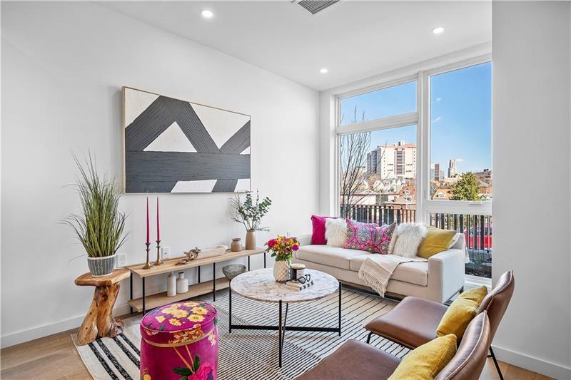112 Burrows Street Pittsburgh, PA 15213 - Photo 4 of 13 a living room with furniture and a potted plant