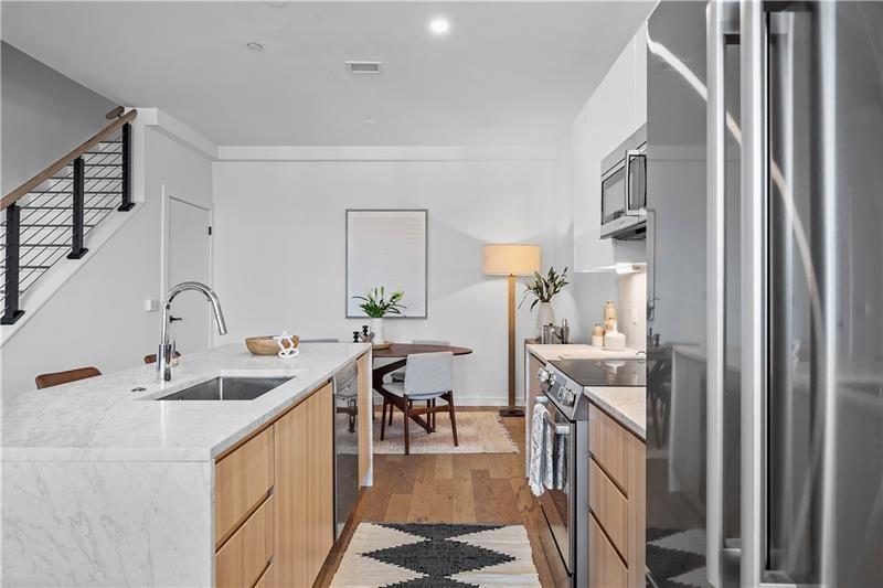 112 Burrows Street Pittsburgh, PA 15213 - Photo 6 of 13 a kitchen with sink refrigerator and cabinets