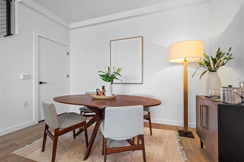 112 Burrows Street Pittsburgh, PA 15213 - Photo 8 of 13 a view of a dining room with furniture and wooden floor