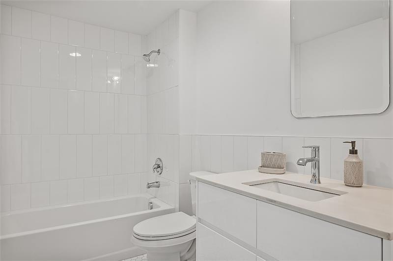 112 Burrows Street Pittsburgh, PA 15213 - Photo 10 of 13 a bathroom with a sink a toilet and shower