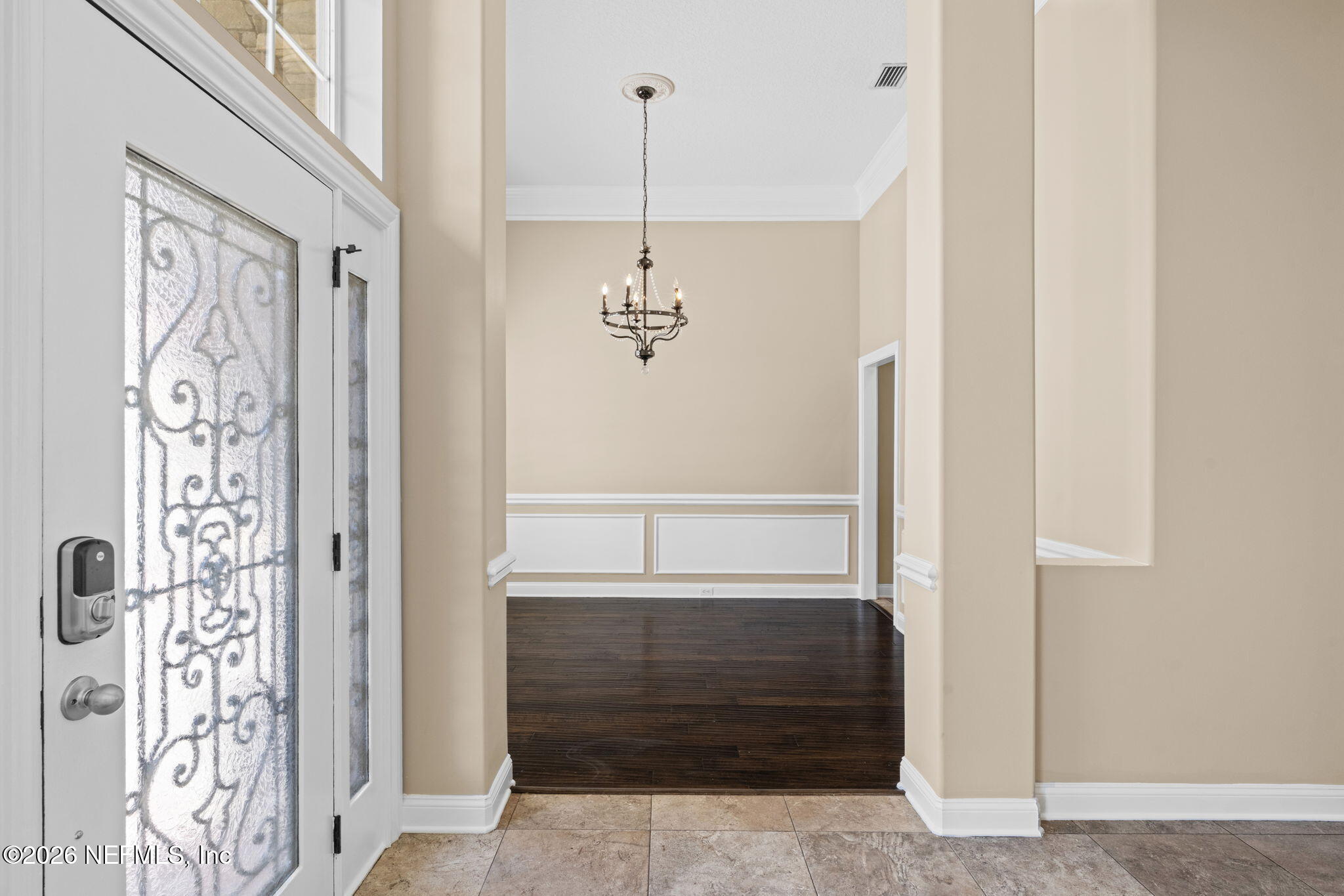 1600 Spring Water Court Fleming Island, FL 32003 - Photo 15 of 85 a view of a hallway with windows and chandelier