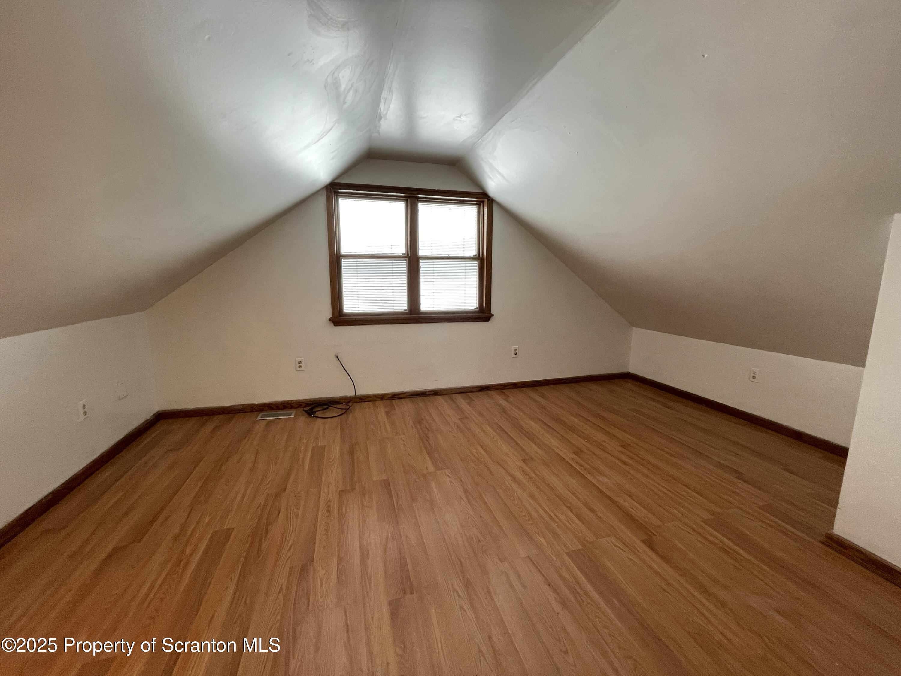 2 Lord Avenue Simpson, PA 18407 - Photo 25 of 62 an empty room with wooden floor and windows