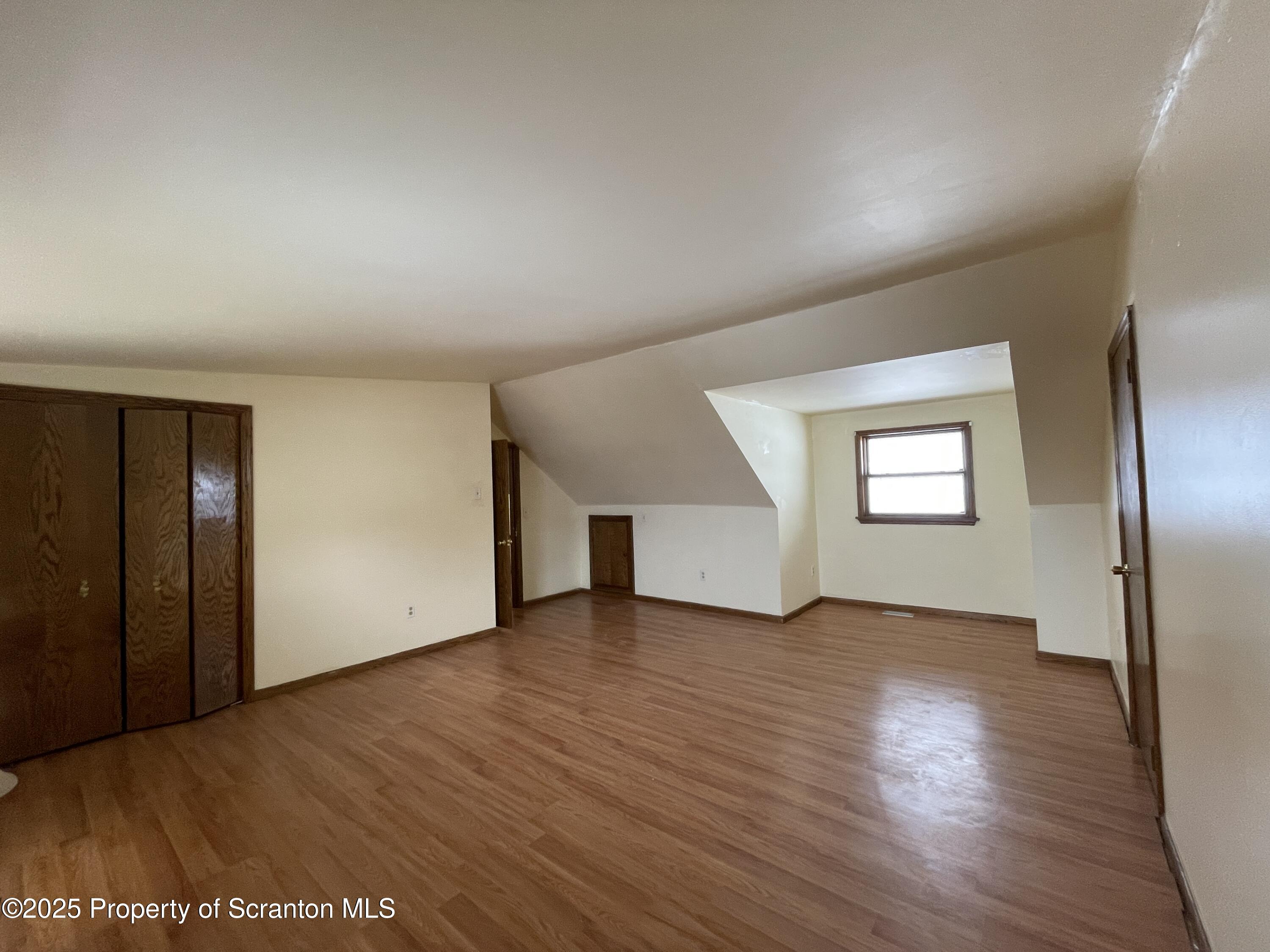 2 Lord Avenue Simpson, PA 18407 - Photo 27 of 62 an empty room with wooden floor and windows