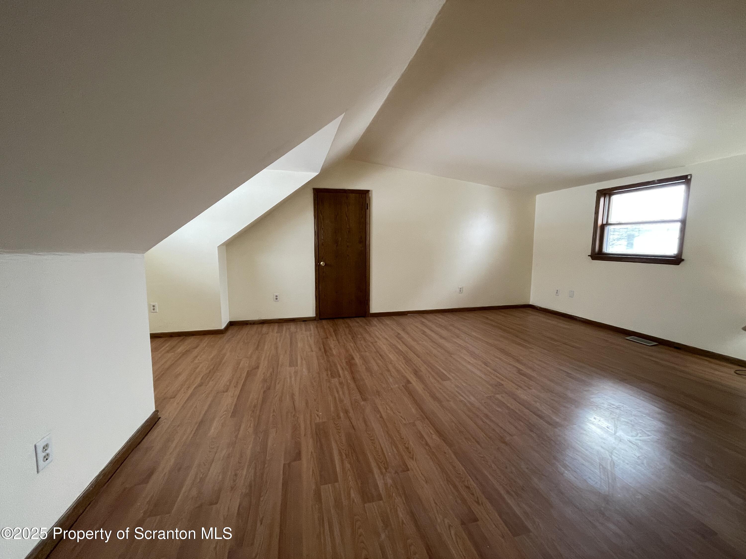2 Lord Avenue Simpson, PA 18407 - Photo 28 of 62 a view of an empty room with wooden floor and a window