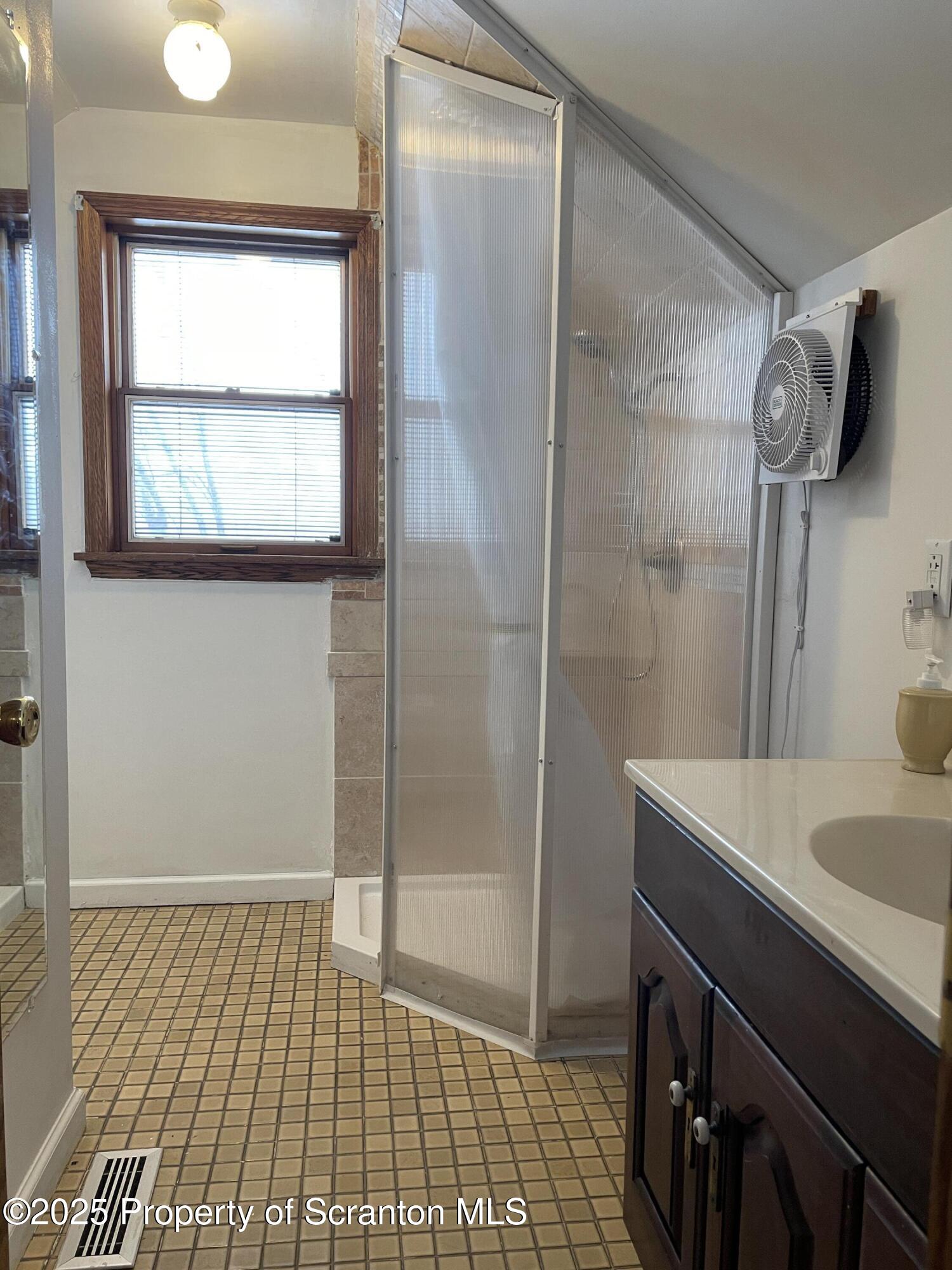 2 Lord Avenue Simpson, PA 18407 - Photo 31 of 62 a bathroom with a sink and a shower