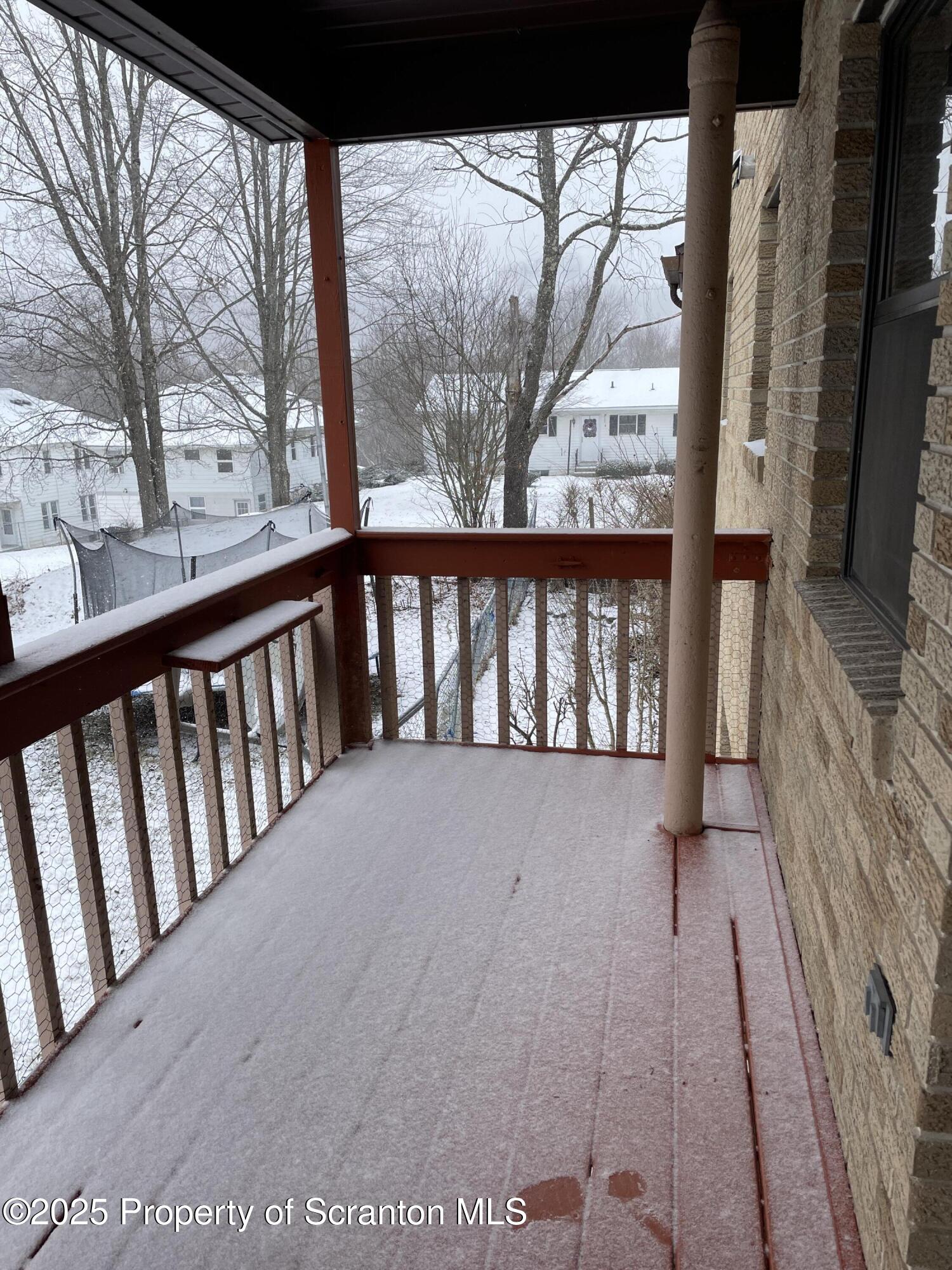 2 Lord Avenue Simpson, PA 18407 - Photo 39 of 62 a view of a balcony with wooden floor and fence
