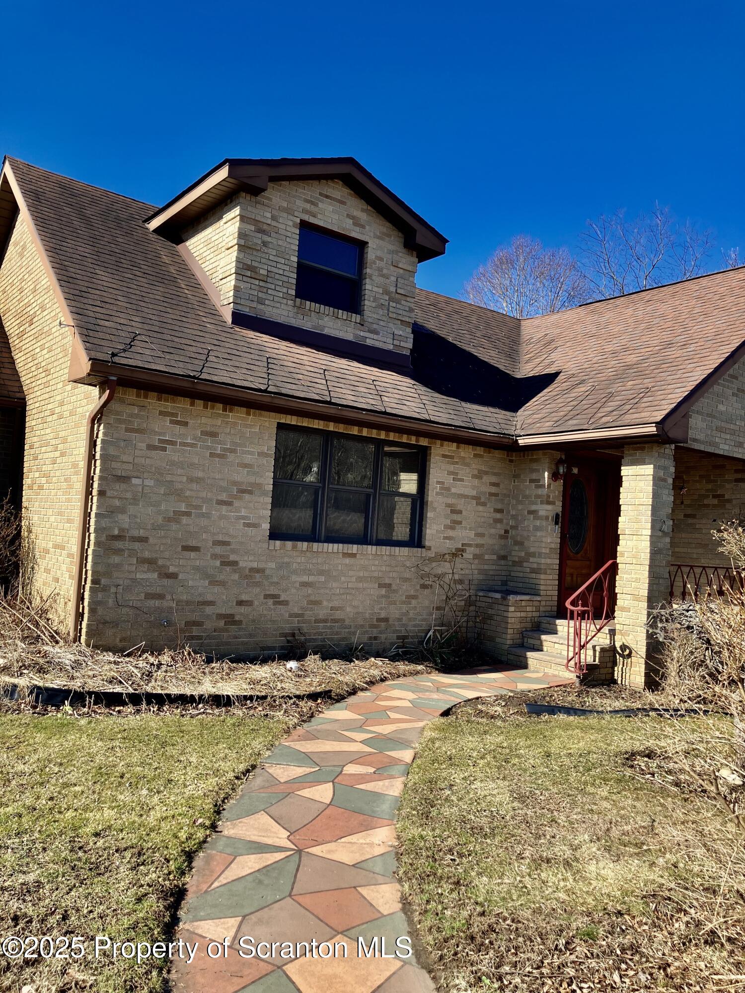 2 Lord Avenue Simpson, PA 18407 - Photo 4 of 62 a front view of a house with a yard