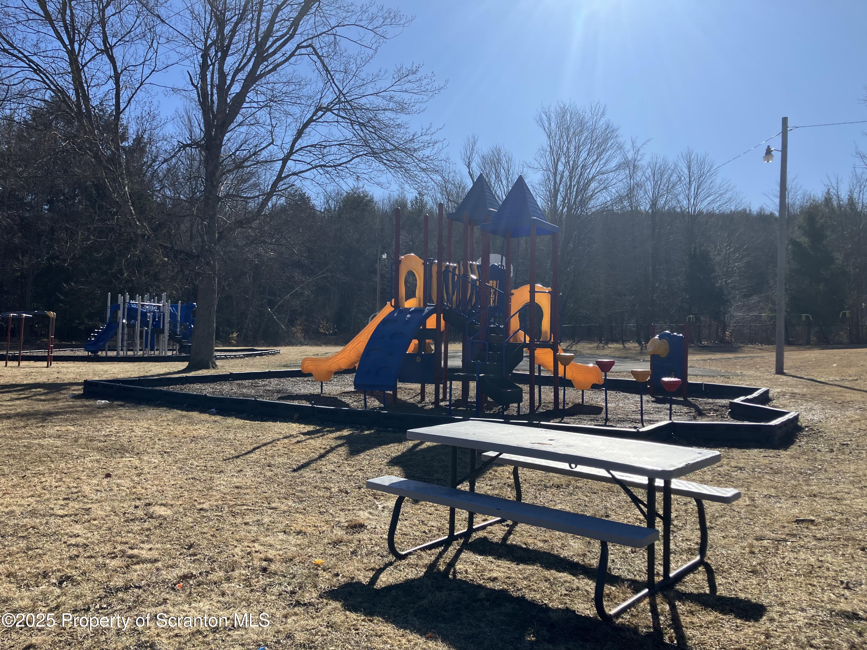 2 Lord Avenue Simpson, PA 18407 - Photo 51 of 62 a backyard of a house with table and chairs