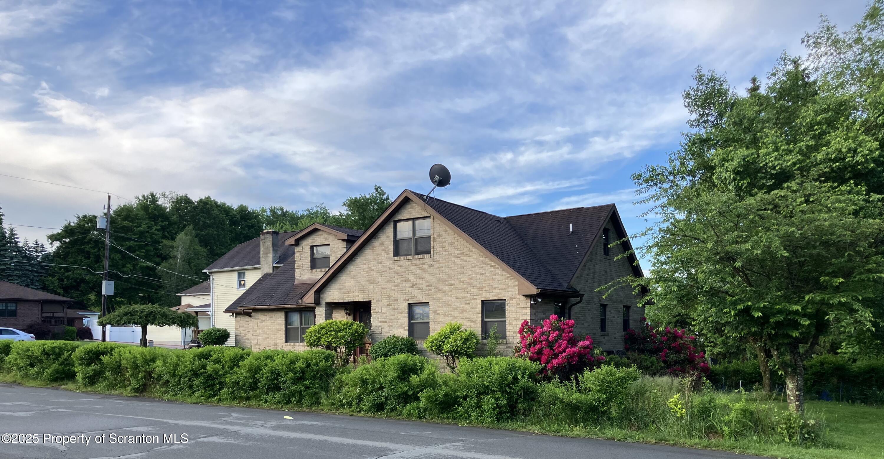 2 Lord Avenue Simpson, PA 18407 - Photo 59 of 62 a view of house and garden with large trees
