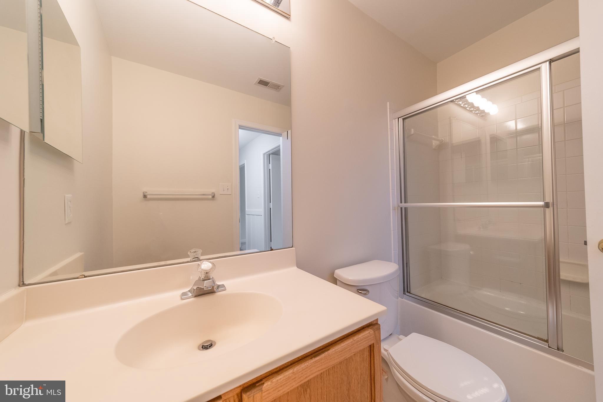 105 Whitestone Way Frederick, MD 21702 - Photo 13 of 19 a bathroom with a sink toilet and shower