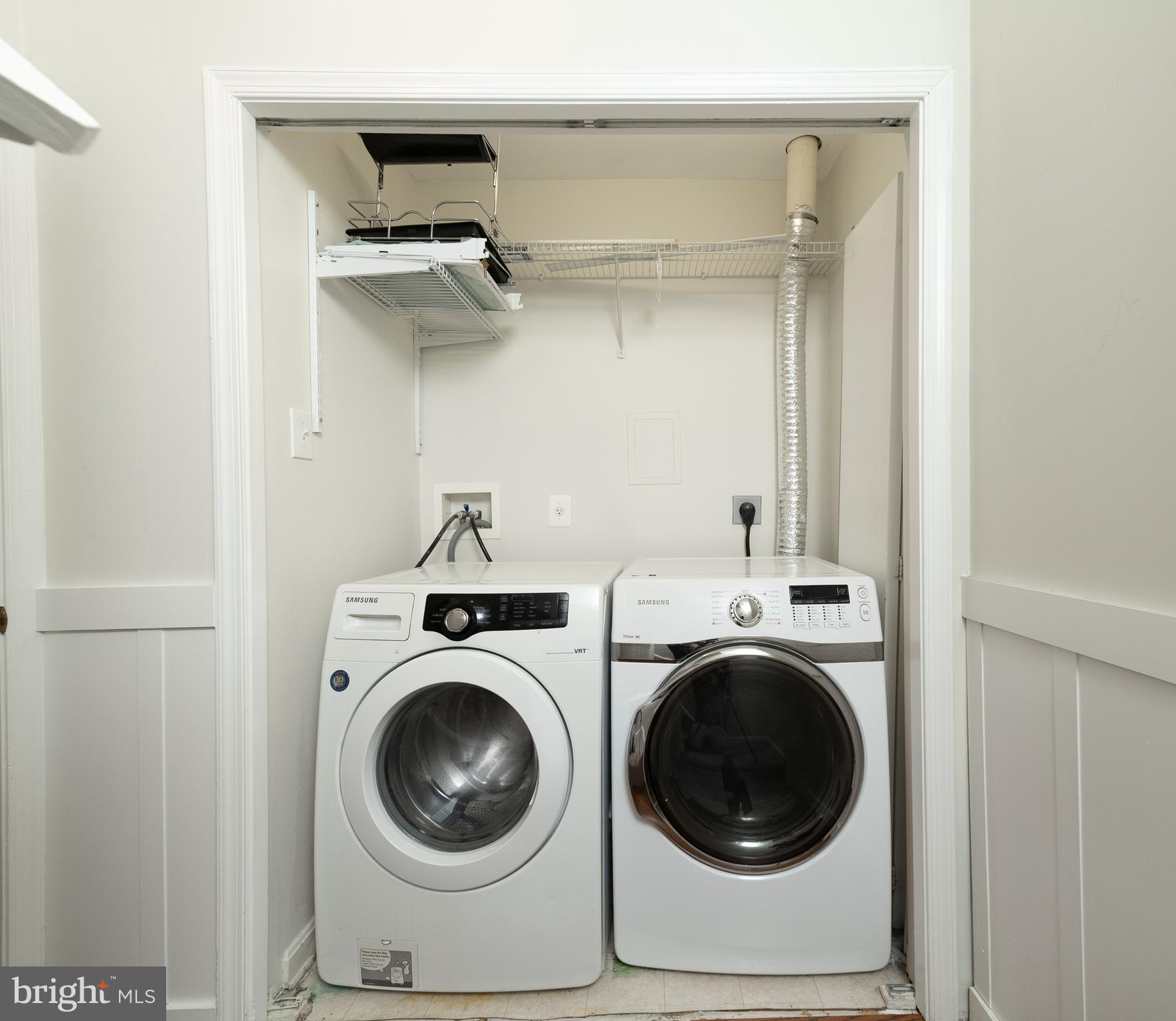 105 Whitestone Way Frederick, MD 21702 - Photo 16 of 19 a utility room with dryer washer and a view of bedroom