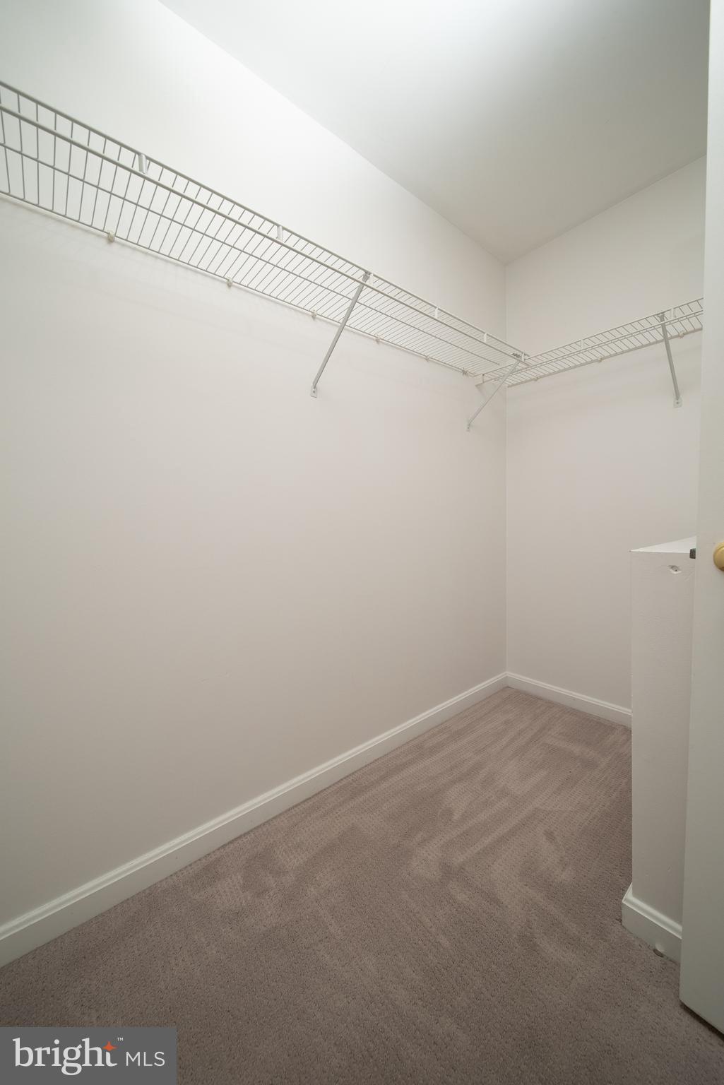 105 Whitestone Way Frederick, MD 21702 - Photo 19 of 19 a view of a room with racks on the wall