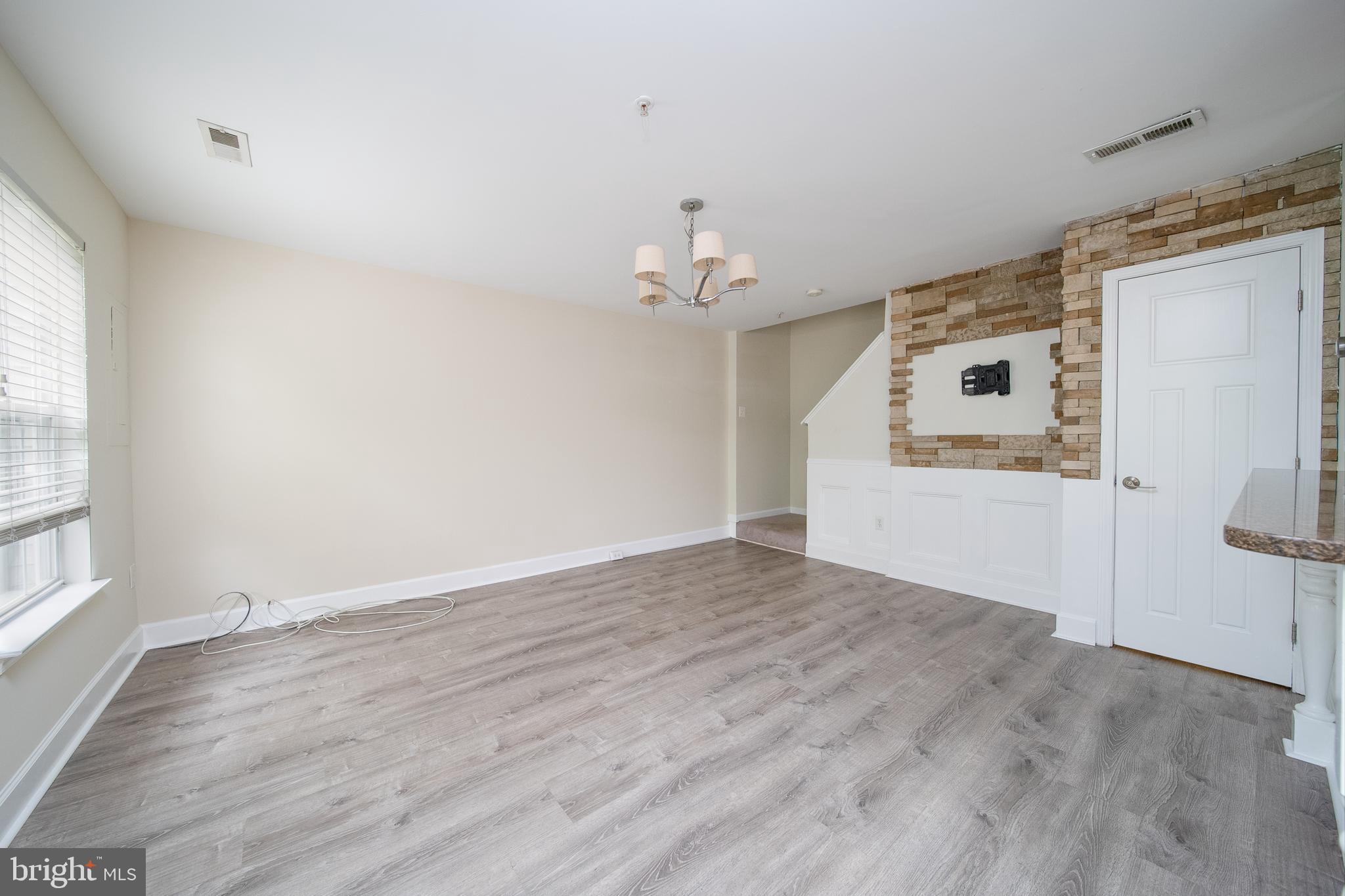 105 Whitestone Way Frederick, MD 21702 - Photo 4 of 19 a view of a livingroom with wooden floor and a window