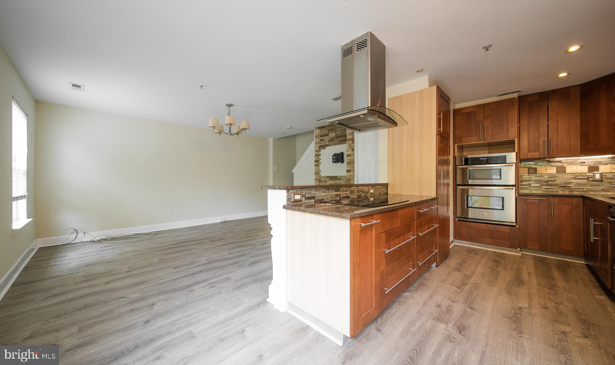 105 Whitestone Way Frederick, MD 21702 - Photo 5 of 19 a kitchen with stainless steel appliances granite countertop a stove and a refrigerator