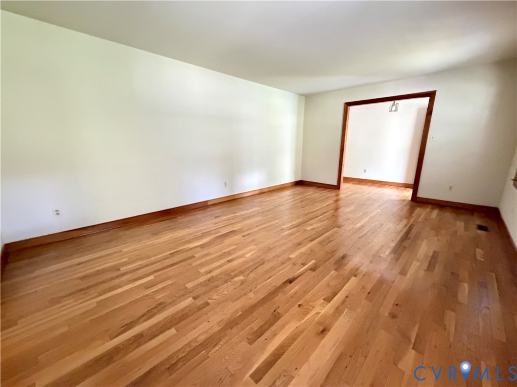 3933 Dunraven Road North Chesterfield, VA 23236 - Photo 16 of 30 a view of an empty room with wooden floor and a window