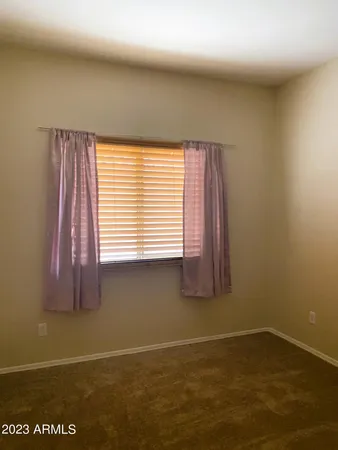 a view of a room that has a window in it