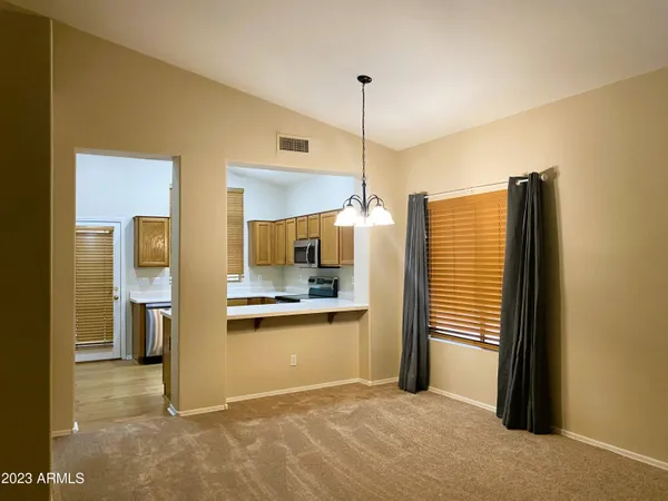a view of a kitchen and a window