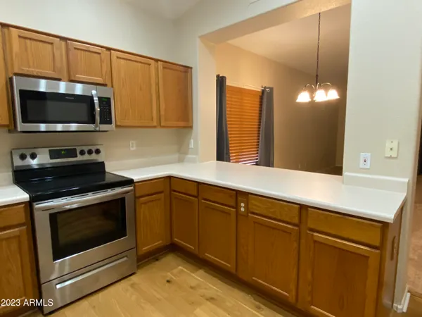 a kitchen with a sink and a microwave