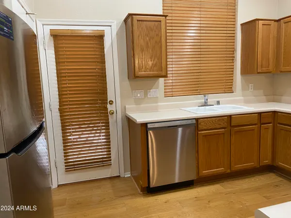a kitchen with a sink and a window