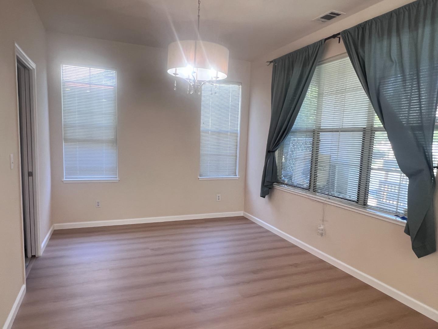 110 Whits Road Mountain View, CA 94040 - Photo 18 of 33 a view of an empty room with wooden floor and a window