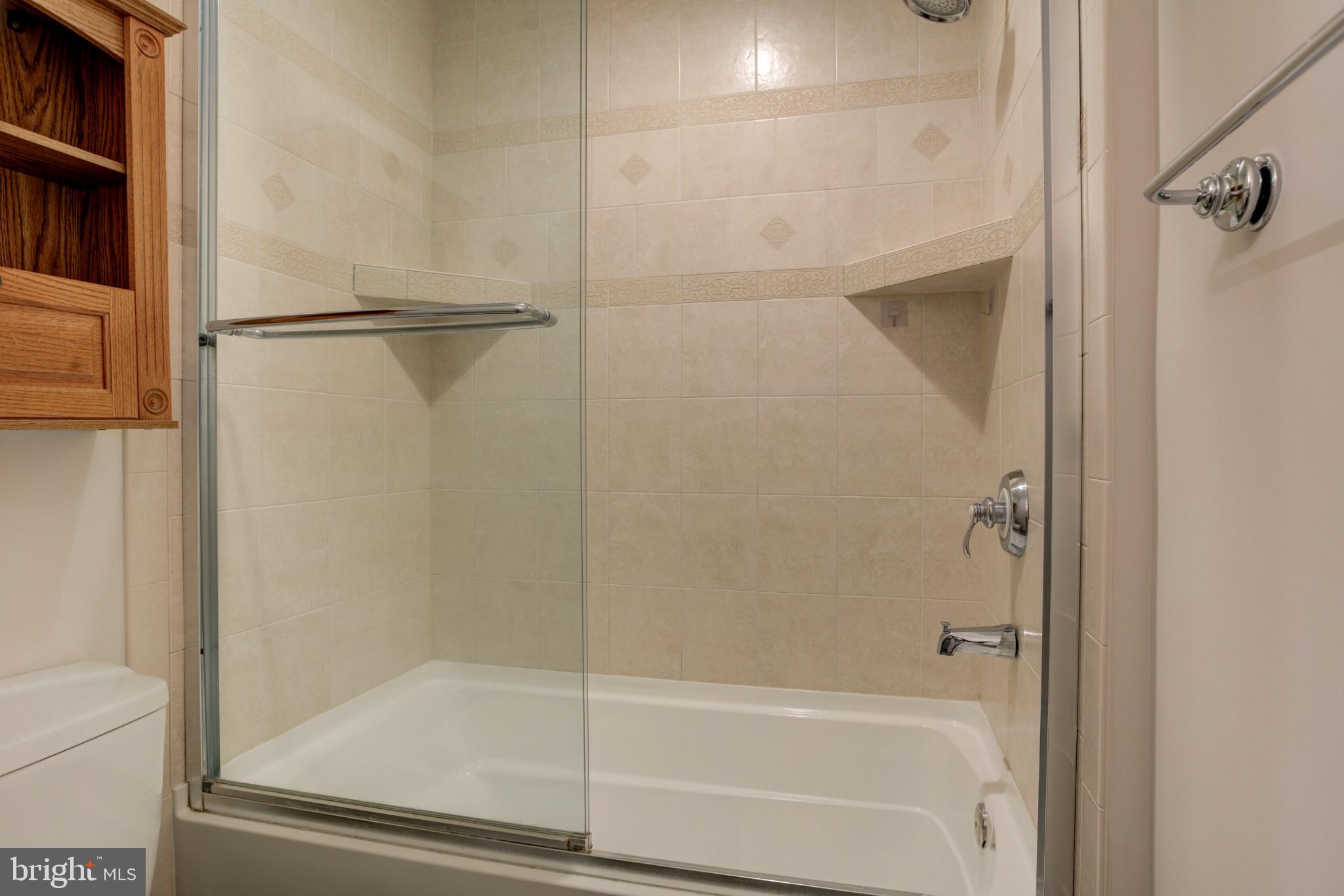 11908 Barrel Cooper Court Reston, VA 20191 - Photo 37 of 40 Modern bathroom with elegant glass shower.