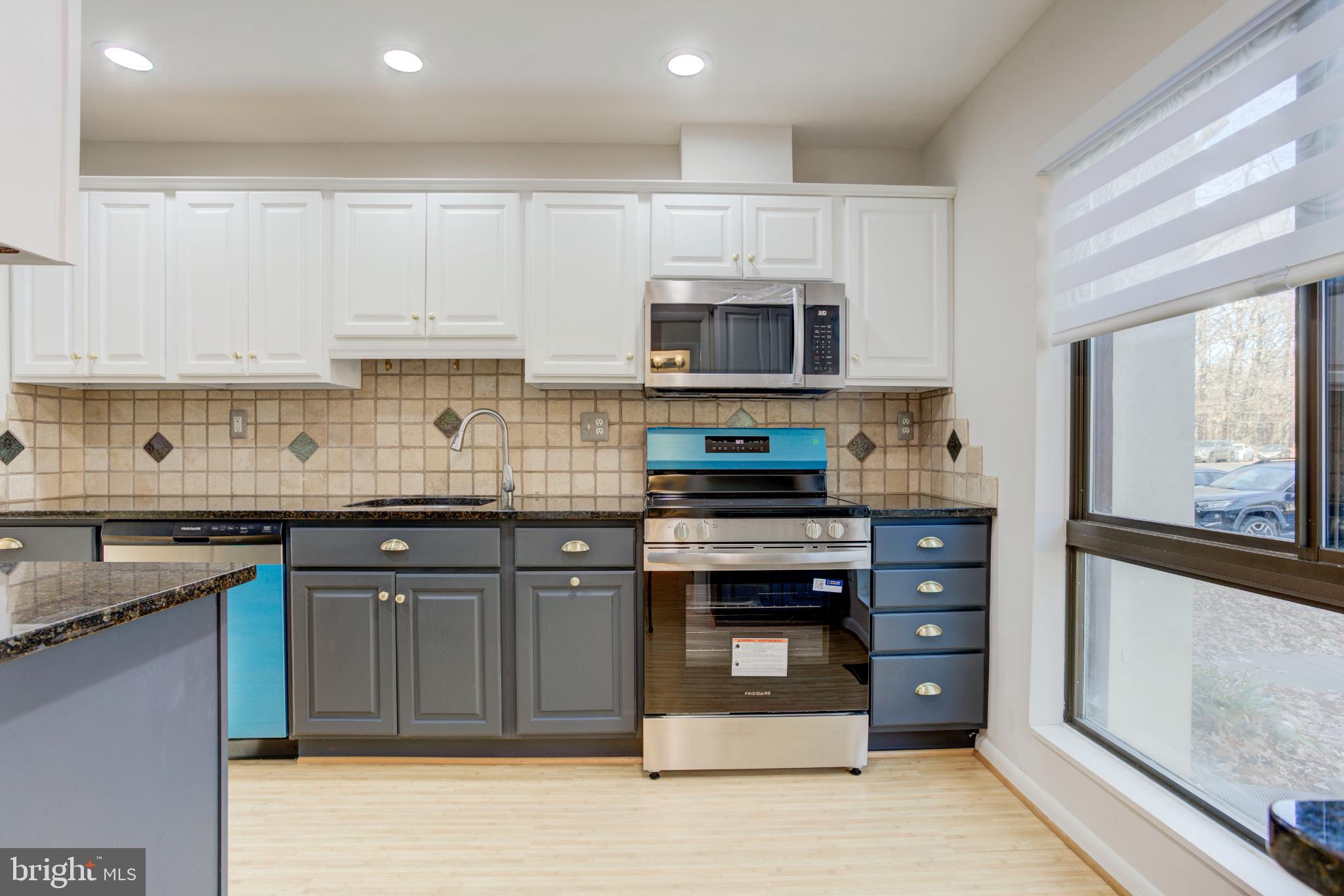 11908 Barrel Cooper Court Reston, VA 20191 - Photo 5 of 40 Modern kitchen with stylish blue accents.