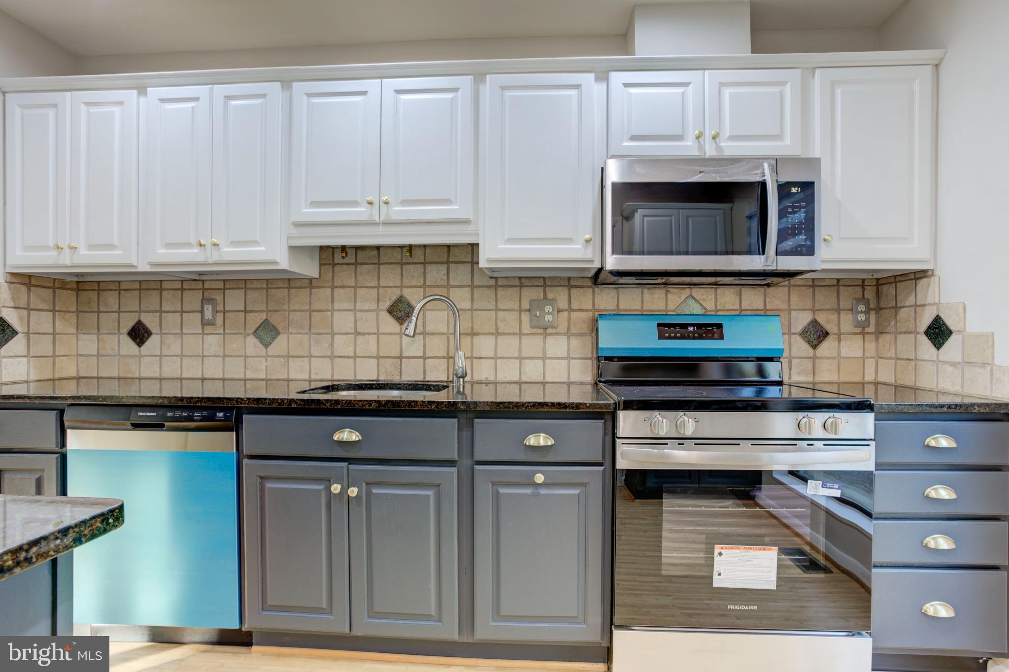 11908 Barrel Cooper Court Reston, VA 20191 - Photo 7 of 40 Modern kitchen with stylish cabinetry.