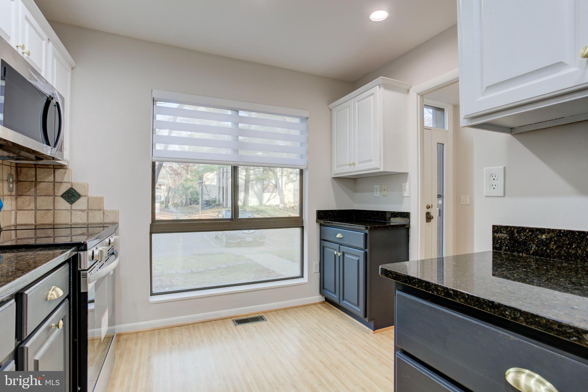 11908 Barrel Cooper Court Reston, VA 20191 - Photo 9 of 40 Modern kitchen with sleek finishes.