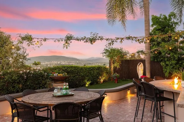 a view of a chairs and table in patio