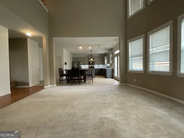 a view of livingroom with furniture and a chandelier