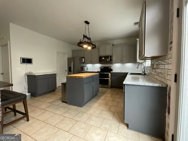 a large kitchen with a cabinets and counter space